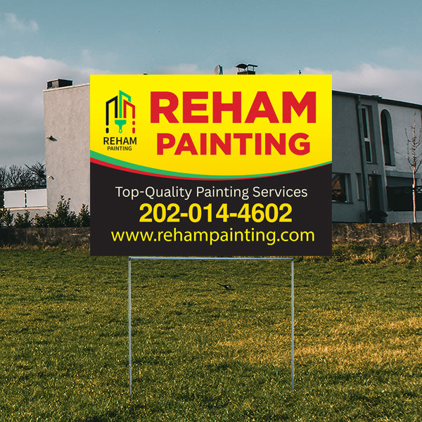 Reham Painting advertisement sign on a grassy lawn in front of a modern house displaying top-quality painting services with phone number and website.
