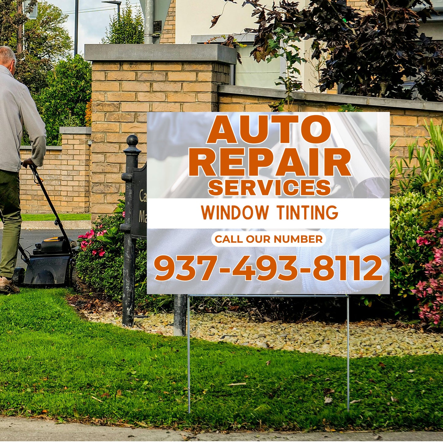 S-yard sign for auto repair services and window tinting with a phone number, placed in front of a house.