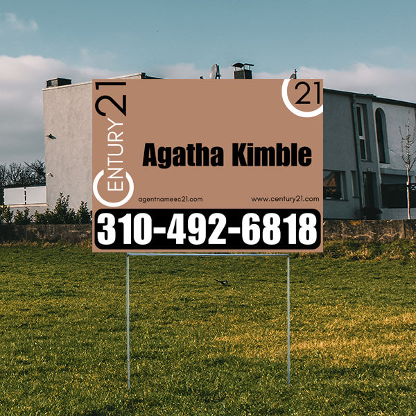 Real estate sign for Century 21 agent Agatha Kimble with contact number 310-492-6818, displayed on a grassy lawn in front of a modern house.