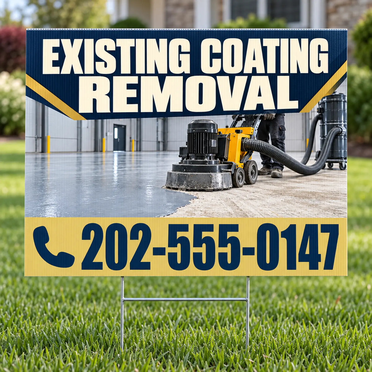 A yard sign on a metal stand placed in a grassy lawn, featuring a printed photo of an industrial coating removal machine in use inside a garage, with large text reading 'EXISTING COATING REMOVAL' and a phone number '202-555-0147'.