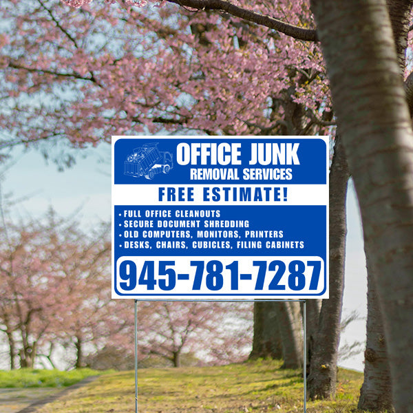 Office junk removal services sign offering free estimate, featuring contact number 945-781-7287, with cherry blossom trees in the background.