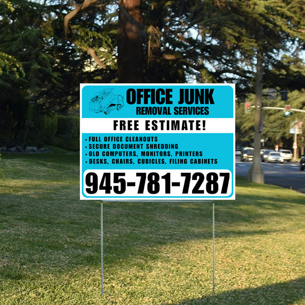 Office Junk Removal Services yard sign offering free estimates and contact number for office cleanouts, document shredding, and disposal of old electronics and furniture, placed on a grassy lawn with trees in the background.