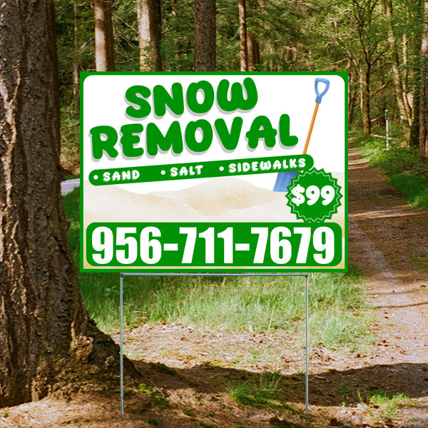 Snow removal service yard sign in a wooded area offering sand, salt, and sidewalk clearing for $99, with contact number 956-711-7679.