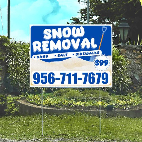 Lawn sign advertising snow removal services with shovel graphic, offering sand, salt, sidewalk clearing for $99, contact number 956-711-7679.