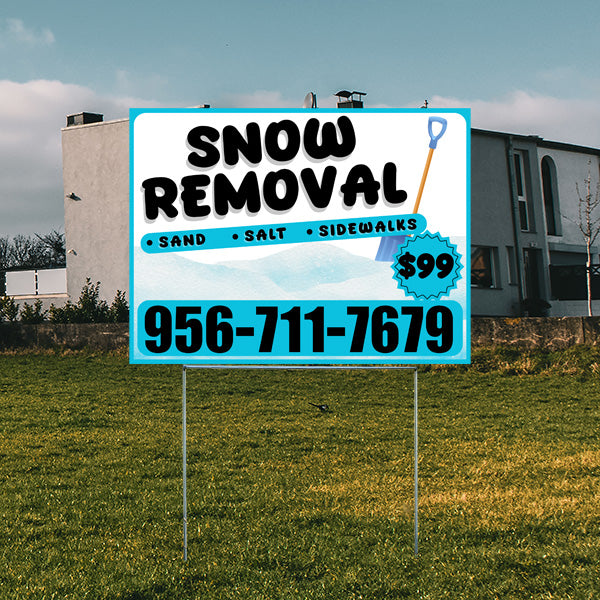 Outdoor sign promoting snow removal services with phone number 956-711-7679, featuring sand, salt, and sidewalk options for $99.