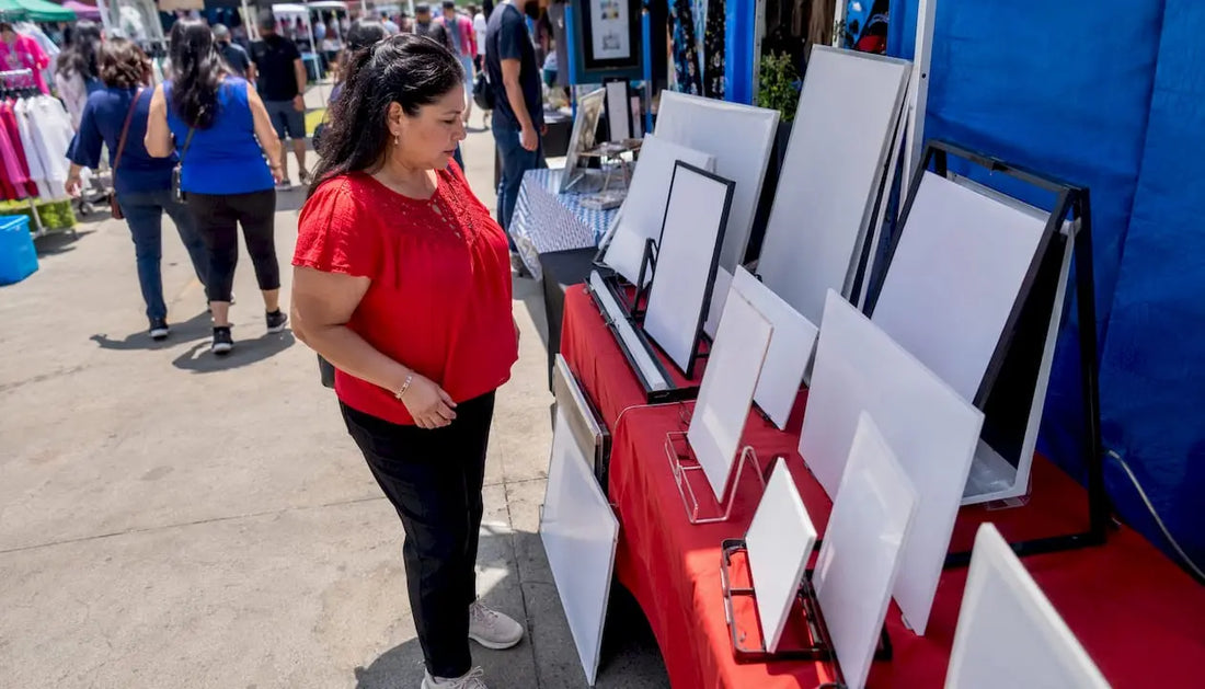 Small business owner evaluating outdoor signs