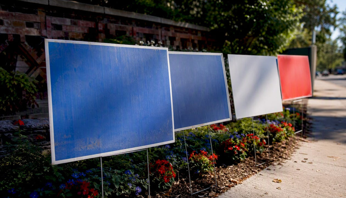 Faded and vibrant yard signs on lawn