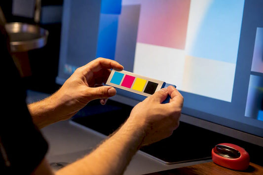 Technician checking CMYK colors before printing
