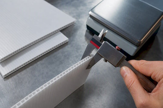 Measuring corrugated plastic sheet thickness