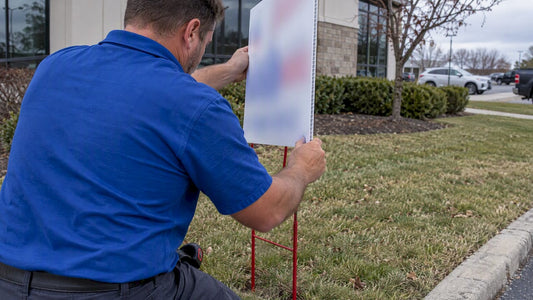 Installer positioning Coroplast sign with vertical flutes