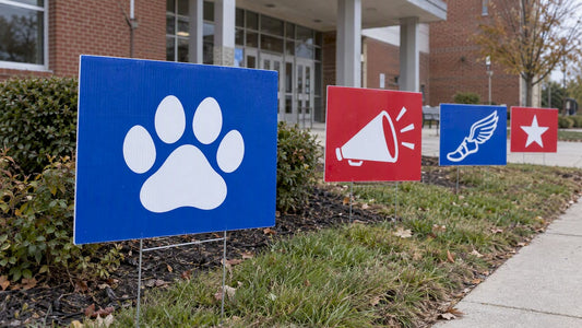 Booster club yard signs outside a school