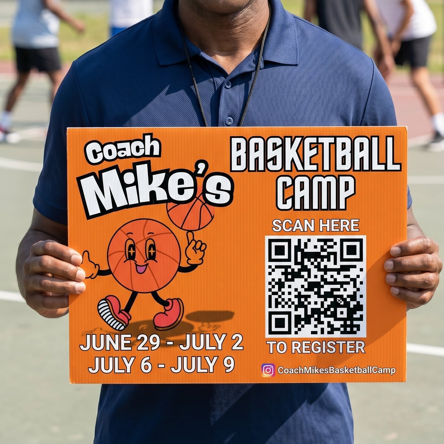 Man holding a sign for Coach Mike's Basketball Camp on an outdoor basketball court.