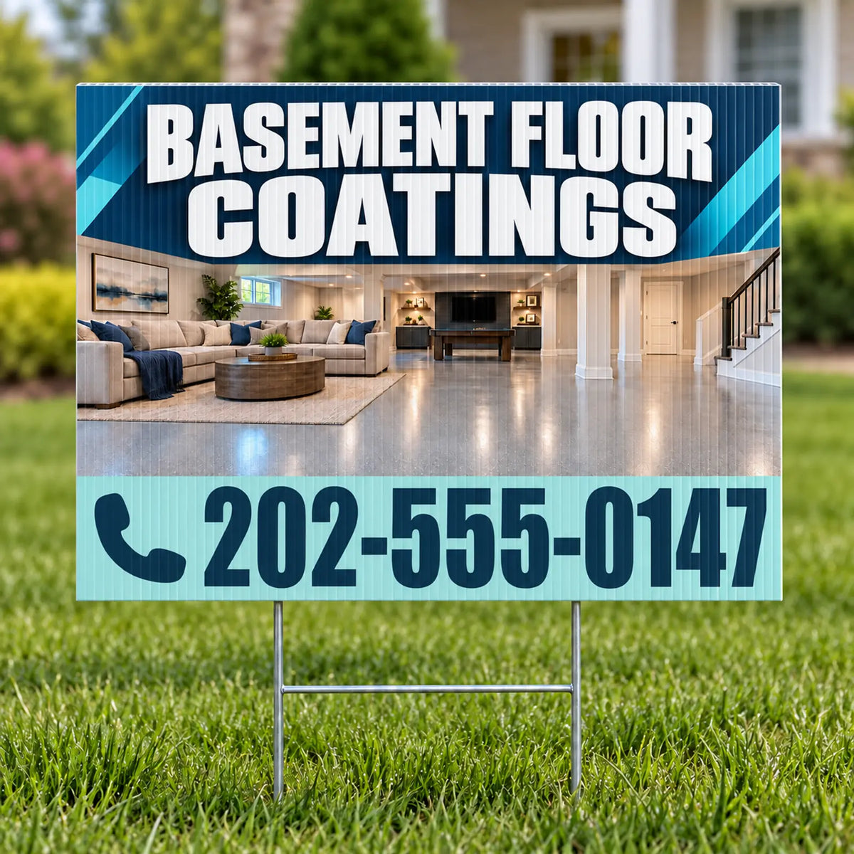 A yard sign displayed on a green lawn, featuring an advertisement for 'Basement Floor Coatings' with a phone number. The sign shows a photo of a modern, well-lit basement living room and has a light blue lower section with the text '202-555-0147' and a phone icon.