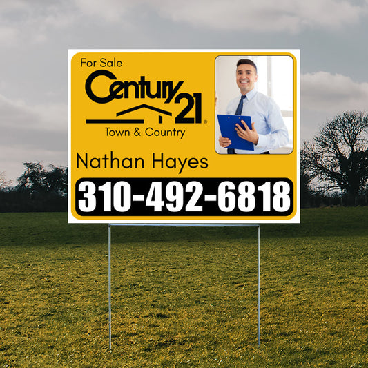 Real estate for sale sign with Century 21 logo, contact information, and image of a professional holding a blue folder.