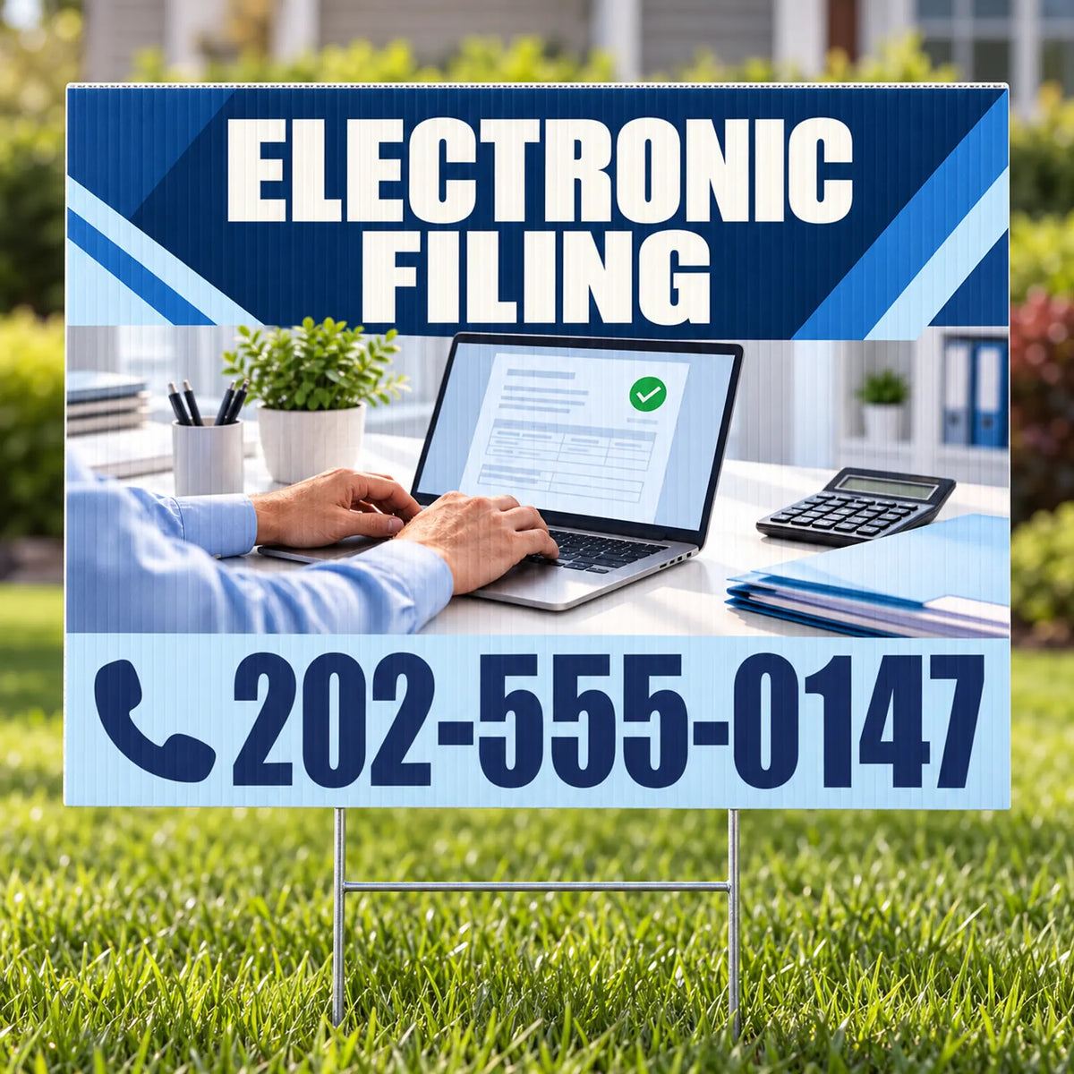 A yard sign displayed on a green lawn, featuring a printed design with the text 'ELECTRONIC FILING' in white on a dark blue header, a photo of a person typing on a laptop, and the phone number '202-555-0147' on a light blue lower section.