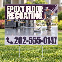 A yard sign on a metal stake displayed on a green lawn, featuring a promotional graphic for epoxy floor recoating with a worker mopping a glossy floor and the phone number 202-555-0147.