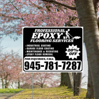 Advertisement sign for professional epoxy flooring services with cherry blossoms in the background