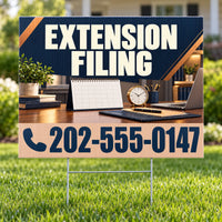 A yard sign on a metal stake in a grassy lawn, featuring the text 'EXTENSION FILING' in large white letters on a dark navy background, with a wood-toned lower section displaying a phone number. The sign is photographed outdoors with a blurred desk scene in the background.