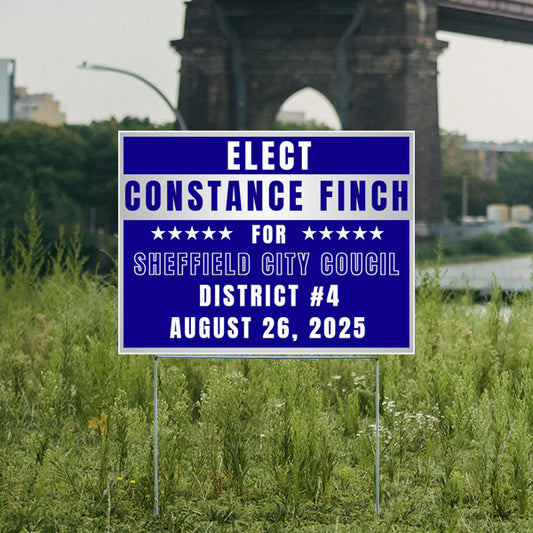 Campaign sign for Constance Finch running for Sheffield City Council, District 4, election date August 26, 2025, placed in a grassy area with a bridge in the background.