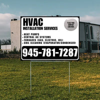 HVAC installation services yard sign with phone number 945-781-7287, offering heat pumps, central AC systems, furnaces, and coil cleaning, displayed in a residential area.