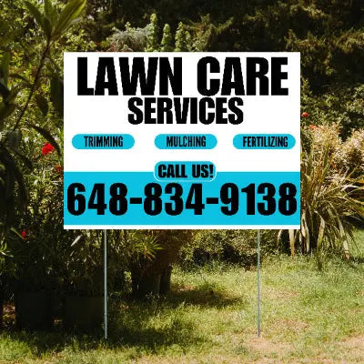 Lawn care services sign with contact information in a garden setting