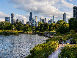 City skyline with a park and lake in the foreground
