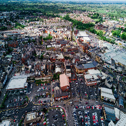 Aerial view of a cityscape with buildings and roads