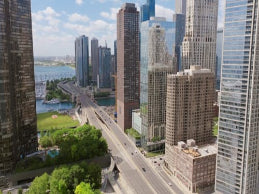 Cityscape with tall buildings and a river