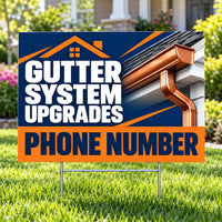 A yard sign on metal stakes in a grassy lawn, featuring a house roof gutter design with the text 'GUTTER SYSTEM UPGRADES' and 'PHONE NUMBER'.